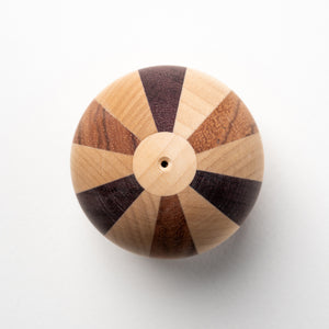 One of the most intricate kendama designs made of maple, rosewood, and purpleheart. Designed by Ayumu Haitani.